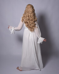 Full length portrait of blonde woman  wearing  white historical bridal gown fantasy costume dress....