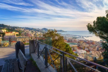 Selbstklebende Fototapete Ligurien Panoramic view of Sanremo or San Remo from Pigna hill, Italian Riviera, Liguria, Italy. Scenic sunset landscape with city architecture, sea, green hills, blue water and sky, outdoor travel background