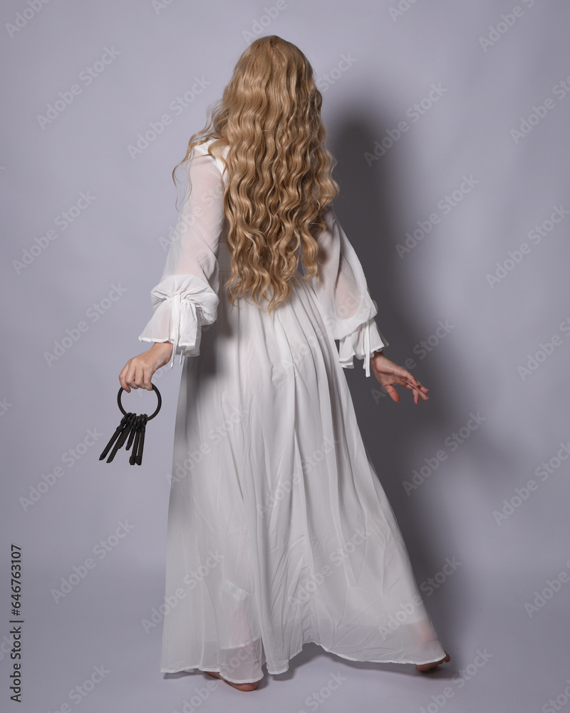 Poster Full length portrait of blonde woman  wearing  white historical bridal gown fantasy costume dress. Standing pose, facing backwards walking away from camera, isolated on studio background.