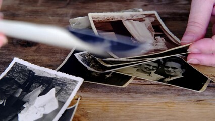 old photos from 1940, envelopes from letters, home archive documents on wooden table, concept of family tree, genealogy, memories, memory of ancestors, nostalgia, childhood remembering