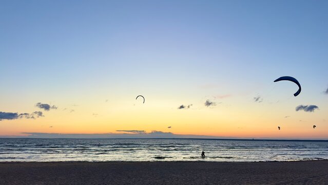 kite surfing at beautiful sunset. Beach, sea landscape 