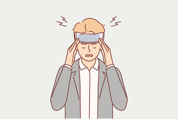 Sick man with bandaged head suffers from headache after getting into car accident