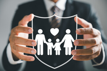Insurance concept brought to life, Businessman with protective gesture ensures family security,...