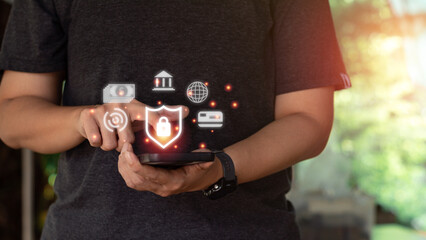 Internet and cybersecurity concept. A businessman is protecting personal data on mobile or smartphone. Online financial errands, data transfer, communication, big data, a virtual lock icon.