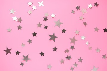 Silver stars glittering confetti on pink background. Trendy festive holiday backdrop. Many star-shaped particles for a postcard, invintation or web, Generative AI