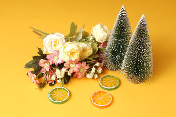 Flowers, Crismast tree and Orange isolated on yellow background