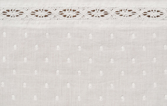 Texture of spotted fabric with a lace line