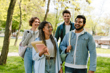 Group of students spending time together in park