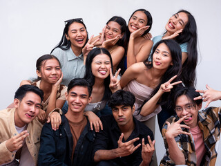 A diverse group of eleven young asian college students posing together smiling. 6 women, 4 guys and 1 trans woman. Isolated on a white background.