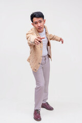 A concerned guy reaches with his hands out to offer his help. A man saving someone. Whole body...