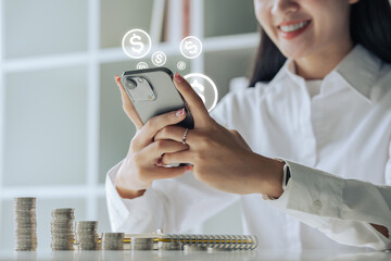 Asian woman hand using mobile phone with online income, Concept financial technology and fintech