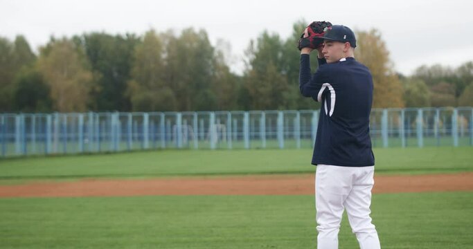 Baseball game, the pitcher throws the ball towards the batter, college sports, 4k slow motion.