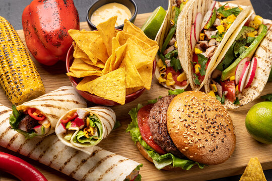 Mexican food featuring tacos, burritos, nachos, burgers