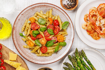 Italian pasta adorned with fresh tomatoes and aromatic basil