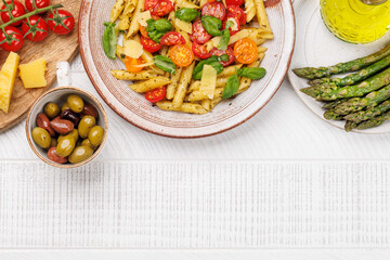 Italian pasta adorned with fresh tomatoes and aromatic basil