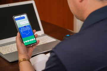 A man using AI voice services on a mobile device. artificial intelligence concept