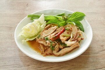 Thai spicy slice boiled pork neck salad eat couple fresh cabbage and yard long bean on plate 