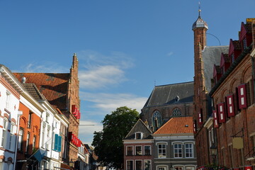 Traditional historic medieval houses in the old picturesque town of Doesburg, Gelderland, Netherlands, with the Stadhuis (Town Hall), de Waag building (weigh house) and Martinikerk church 