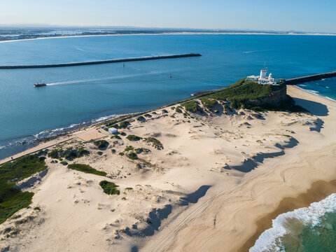 Lighthouse and estuary at Newcastle Harbour seem from aerial view