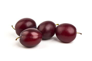 Isolated plums. One and a half of blue plum fruit, isolated on white background.