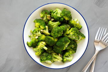 Homemade Pan-fried Broccoli on a Plate on a gray background, top view.