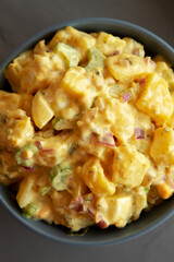 Homemade Classic Potato Salad in a Bowl, top view. Flat lay, overhead, from above.