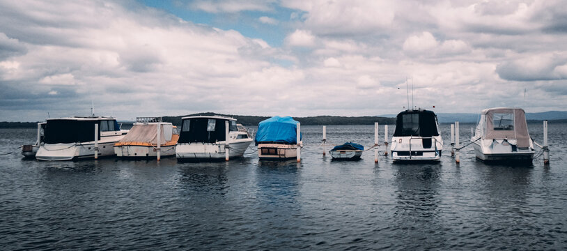 Group of Boats Moored on a calm Lake