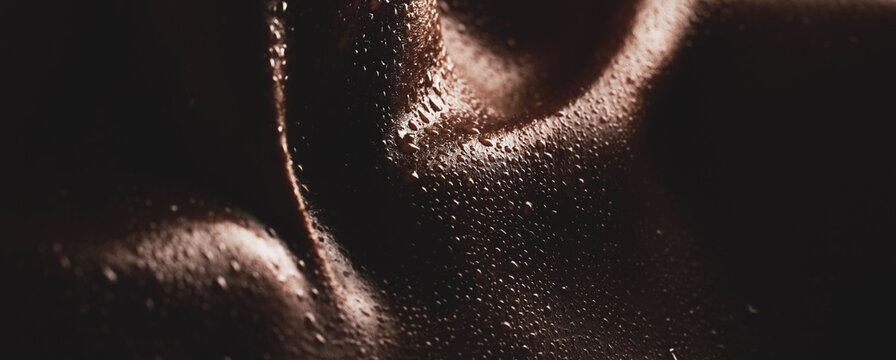 Body, water drops or skin and texture of a person for dermatology, skincare and hygiene. Zoom on aesthetic model for art deco, silhouette and sweat with droplets, creative and dark background