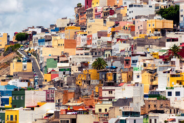 Fototapeta na wymiar Photo of the colorful houses in the town of San Juan, Las Palmas de Gran Canaria, in the Canary Islands, taken in July.
