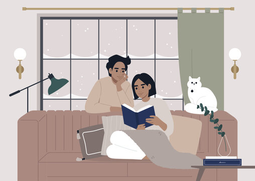 A warm and inviting winter interior envelops a couple in its embrace as they enjoy a book together during the festive Christmas holidays