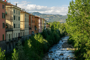 Fototapeta na wymiar houses and bridge in the town Porretta, Italy in summer days.