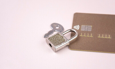 Financial fraud protection concept: credit card, padlock and master key.
