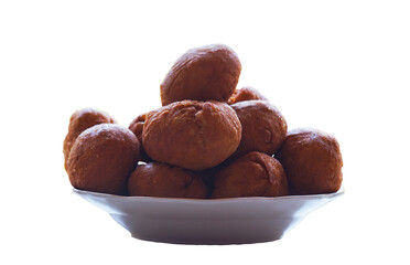 Round loaves in a bowl on a white background