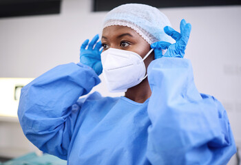 Scrubs, face mask and black woman, hospital surgeon or healthcare expert ready for surgery, clinic...