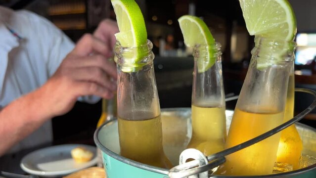 Glass Of Refreshing Ice Cold Cider With Lime Outside Close Up. High quality 4k footage