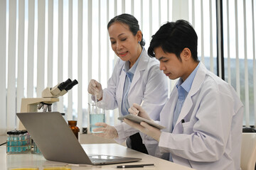 Researchers experimenting in the lab. Scientific experiment.
