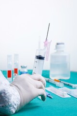 Doctor handling a syringe with medicine to be injected, aspirated medicine.