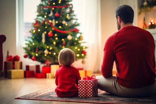 Toddler boy and father, at Christmas in living room with Christmas presents and tree, empty copy space Generative AI