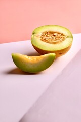 Creative photo of a melon on colorful background. Copy space. 