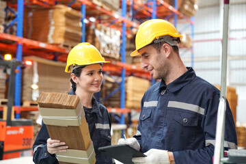 Warehouse Industrial supply chain and Logistics Companies inside. Warehouse workers checking the inventory. Products on inventory shelves storage. Worker Doing Inventory in storehouse. 