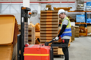 Warehouse Industrial supply chain and Logistics Companies inside. Warehouse workers checking the inventory. Products on inventory shelves storage. Worker Doing Inventory in storehouse. 