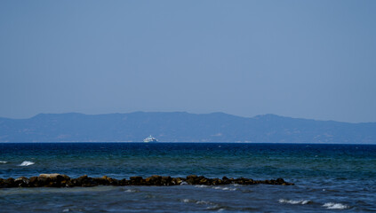 boat with tourists in the vicinity of the island of Thassos. landscape.