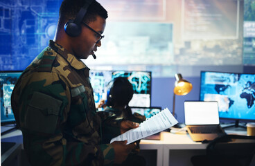 Control room, military documents and people on computer for surveillance, tracking operation and national security. Army, government report and soldiers for cybersecurity, communication and network