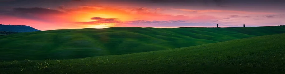 Fototapeten A dreamy landscape at the sunset, banner image with copyspace © danieleorsi