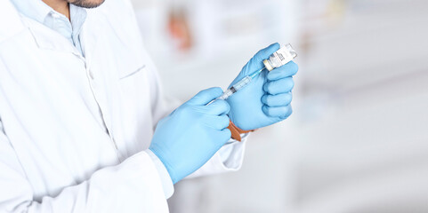 Hands, healthcare a vaccine with a doctor in the hospital closeup for treatment or cure using a syringe. Medical, needle and injection with a medicine professional in a clinic for pharmaceutical care