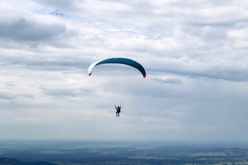Schwangau, Germany - August 12, 2023: Paragliding over Neuschwanstein Castle in Germany