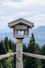 Beautiful wooden birdhouse set in the Bavarian Alps