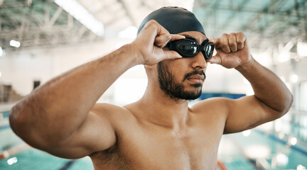Getting ready, man and goggles for swimming training, competition or a race in the pool. Fitness,...
