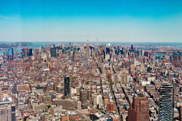Aerial View Above New York City Along Manhattan with the Empire State Building in the Center
