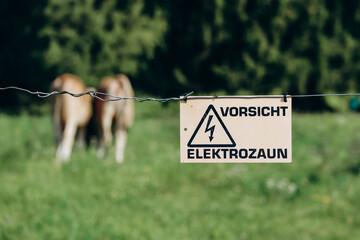 Fototapeta premium Electric fence warning sign 